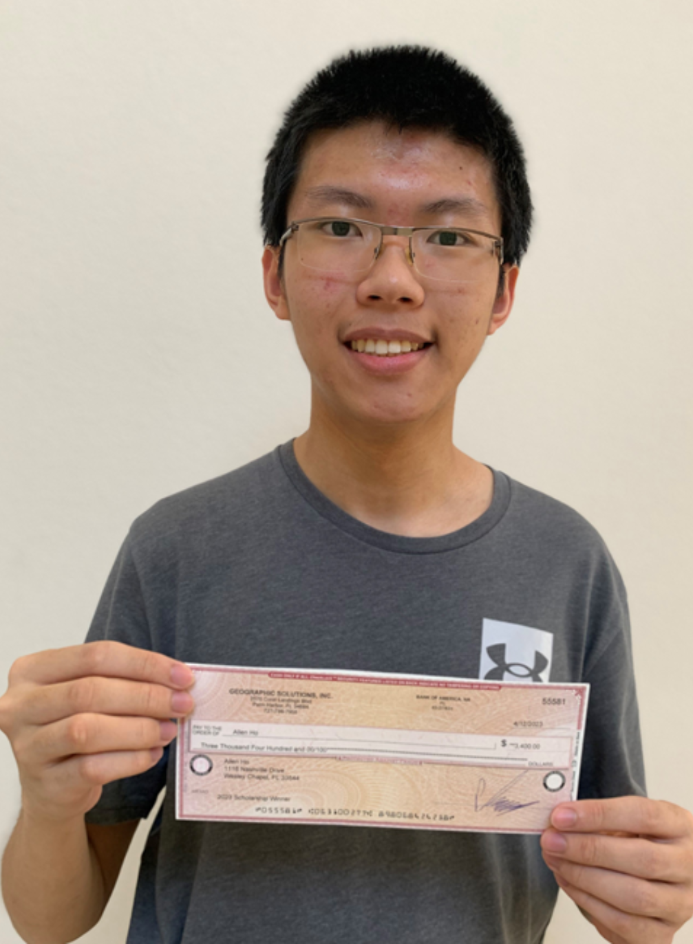 Allen Ho holding IT Scholarship Award check